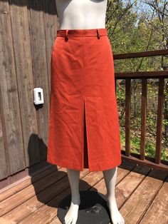 Vintage orange mister Leonard skirt. Made from a polyester and wool blend (40% wool). Fully lined. Has nice large pleats for easier walking. A great burnt orange colour that's great for fall. IN good condition with one light mark on the front.  Fits size small  26-27" waist (27 will be tight) 36" hips 28.5" length Midi Skirt Winter, Skirt Winter, Orange Skirt, Orange Colour, Skirt Pleated, Burnt Orange Color, Winter Skirt, Vintage Orange, Rust Color