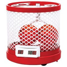 a red clock sitting on top of a white net