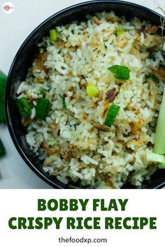 a bowl filled with rice and celery on top of a table