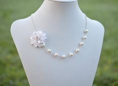 "The Listing is for 1 Dahlia Necklace. There are 2 colors to choose from : White Dahlia ( go with White Glass Pearls) or Ivory Dahlia ( go with Ivory/ Cream Glass Pearls) NOTE : if you prefer different color other than white or Ivory color, please drop a note or convo me when you check out. Variety Dahlia Flower Necklace and Jewelry available in my shop, if you do not find in the listings, feel free to contact me. * Hand Sculpted Dahlia. Size; approx ; 1.5\" * 8mm Ivory/cream/Offwhite Glass pear White Flower Jewelry For Bridesmaid Gift, White Floral Jewelry For Bridesmaid Gift, White Pearl Jewelry With Flower Decoration, Delicate White Bridal Necklace For Bridesmaid Gift, White Flower Pendant Necklace For Wedding, White Flower Necklace For Bridesmaid Gift, Elegant White Flower Bridal Necklace, Delicate White Flower Necklace For Jewelry Making, Pearl White Flower Necklaces For Wedding