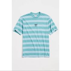 Striped Pattern T-Shirt By Guess Originals With A Logo Accent Embroidered At The Front. Crafted From 100% Cotton Cut In A Standard Fit With Short Sleeves & A Ribbed Knit Crew Neck. Content + Care - 100% Cotton - Machine Wash - Imported Light Blue Crew Neck Shirt For Spring, Light Blue Crew Neck Shirt For Summer, Sporty Blue Top For Summer, Light Blue Graphic Tee With Relaxed Fit, Blue Graphic Tee For Spring, Light Blue Crew Neck Top For Summer, Blue Sporty Short Sleeve Top, Blue Short Sleeve Sporty Top, Summer Light Blue Crew Neck Top