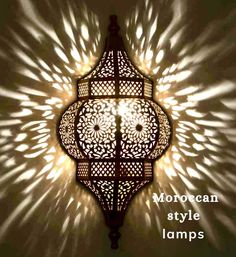 an intricately designed light fixture with the words moroccan style lamps