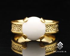 Natural Milky Quartz Gemstone Ring, 24K Gold Plated Ring, 925 Sterling Silver Ring, Wedding Band Ring, Gift For Her, White Jade Ring 💍Item Details💍 SKU CODE: GV15T10118 ★ Material: 24K Gold Plated 925 Sterling Silver ★ Silver Weight: App. 4.65 Grams {6 USA Size} ★ Ring Wide: 5 mm ★ Ring Size: Available in variations  ★ Gemstone: Natural Milky Quartz ★ Gemstone Size: 10mm ★ Gemstone Shape: Dome ★ Ring Plate: Available in variations to Rose Gold & 24K Gold & Black Oxided 💎ABOUT GEMSTONE💎    Mi Gold Opal Ring With Round Stone For Gift, Gold Moonstone Ring With Center Stone For Anniversary, Gold Opal Ring With Round Stone For Wedding, Gold Opal Ring With Center Stone As Gift, Gold Moonstone Ring With Stone Setting For Wedding, Gold Moonstone Wedding Ring, Gold Moonstone Wedding Ring With Stone Setting, Gold Opal Ring With Stone Setting For Anniversary, Gold Spiritual Moonstone Wedding Ring