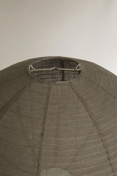 the top of a large metal structure with a round hole in it