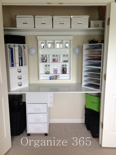 an organized closet with white drawers and shelves