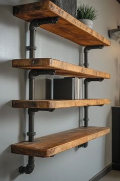 the shelves are made out of wood and metal pipes