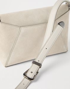 Sueded calfskin envelope bag with monili An elegant, extremely feminine aesthetic meets Brunello Cucinelli’s refined materials and sparkling details in this calfskin suede Envelope bag. The silhouette is reminiscent of a classic letter envelope and is highlighted by the velvety leather. Shiny monili enriches the accessory with a sophisticated sparkle. Letter Envelope, Envelope Bag, Feminine Aesthetic, Eyewear Womens, Boutique Online, Luggage Accessories, Jewelry Creation, Small Leather Goods, Brunello Cucinelli