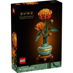 a lego flower pot with flowers in it's center and the box is open