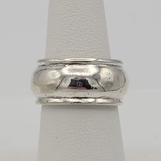 Vintage .925 Sterling Silver Band with Convex Center Statement Right Hand Ring This shining ring makes a great accent piece.  The sterling silver band has a convex center & a fitted top & bottom edge.  The ring is entirely sterling silver. It is in great vintage condition with a small amount of wear & scratches. Size: US 7, 10 mm wide Markings:  None Condition:  Great - small amount of wear & scratches All of my shop items are pre-owned vintage.  All pieces should be expected to have some vintage wear unless otherwise stated.   Great for the vintage & costume jewelry lover!  Be sure to check out our other vintage jewelry listings! Looking for something that isn't listed in my shop? Send me a message! I have thousands of pieces in stock. Classic Silver Band Ring, Classic Silver Wide Band, Classic Wide Band Silver Bands, Silver Stackable Wide Band Rings Stamped 925, Silver Stackable Rings With Thick Band For Formal Occasions, Adjustable White Gold Wide Band Ring For Anniversary, Silver Wide Band Wedding Bands, Silver Stackable Wide Band Ring For Anniversary, Silver Stackable Rings With Thick Band For Anniversary