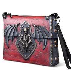 Unique printed versatile shoulder/hand digital art black and red gothic antique style skull bag, a modern bag with a unique artistic design. This faux leather rectangular bag has a print of an antique-style red and black gothic skull style, printed on both sides. It is light and comfortable, great for everyday use. Please consider that the bag features a 2D PRINTED design artwork that is meant to give the IMPRESSION of a 3D design. The bag has no real leather or metal. The zipper is on the top of the bag.   Keep your style on point and your hands-free with this versatile crossbody bag. It's made of premium faux leather and features dark gray hardware. You can keep your essentials secure and organized thanks to the zip-top closure and multiple inside pockets. Transform this crossbody bag wi Gothic Crossbody Travel Bag, Gothic Rectangular Bags For Everyday Use, Gothic Satchel Bag As Gift, Gothic Shoulder Bag For Travel, Gothic Satchel Gift Bags, Gothic Satchel Bag For Gift, Gothic Rectangular Everyday Bags, Gothic Large Capacity Shoulder Bag, Gothic Rectangular Shoulder Bag For Travel