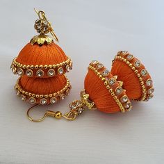 "Handmade earrings wrapped with shiny silk thread with two domes(2.5cm diameter and 2cm diameter).  Now available in holiday colors!  Customization available as well. These earrings are called \"Jhumkas\" in India signified by the dome shape of the hanging, these earrings come in many colors and sizes. These silk thread type will be custom made just for you after you place your order. you can mix and match colors, and you can request earring sets of one color or mix two colors. (look at the image of the cluster of domes, there are two colors in the same earring)  1) Your choice of color/s. Available colors:  orange, gold, white, pink, black, brown , beige,  purple, light green/dark green ( please specify which green in your request) , light blue/dark blue (specify which blue), light red/da Orange Jewelry Set, Silk Thread Jhumkas, Silk Thread Earrings Designs, Silk Earrings, Silk Thread Necklace, Silk Thread Earrings, Diy Jewellery Designs, Diy Wire Earrings, Orange Jewelry