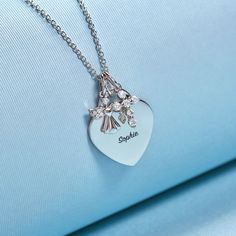 If you're looking for a meaningful gift for a young girl that can be engraved to mark her initials or a special life event, then look no further! This heirloom, engravable heart charm necklace is as special as it gets. Adorned with a protective cubic zirconia guardian angel charm and cross, this personalized heart charm for young girl's is simply perfect. Every part of this necklace set is hand crafted in genuine 925 sterling silver, making it hypoallergenic and suitable for children & teens wit Personalized White Stainless Steel Charm Necklace, Personalized White Gold Pendant Charms, Elegant Personalized Charms As Gifts, Elegant Personalized Charms For Gifts, Personalized White Gold Charm Necklaces For Personalized Gift, Silver Heart Charms For Birthday, Silver Heart Necklace With Hallmark For Birthday, Personalized Heart Charms For Birthday, Personalized White Gold Heart Necklace For Mother's Day