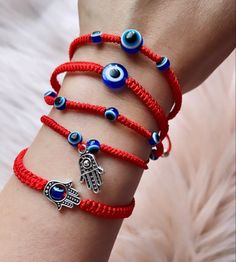 Traditional Jewelry With Sliding Knot For Festival, Adjustable Blue Symbolic Bracelet, Bohemian Jewelry With Adjustable Clasp For Gifts, Bohemian Jewelry With Adjustable Clasp As Gift, Spiritual Adjustable Cord Bracelet, Bohemian Jewelry As A Gift With Adjustable Clasp, Symbolic Handmade Bracelets For Friendship, Adjustable Spiritual Braided Bracelet With Evil Eye, Symbolic Adjustable Beaded Bracelets