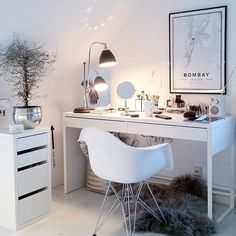 a white desk and chair in a room