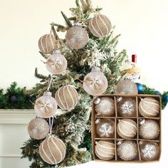 a christmas tree with ornaments in a box