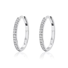 The largest size in our signature huggie series 15 mm Solid 18K Gold 16 round 1.1mm brilliant diamonds on each hoop, VS quality, G/H Color. TCW = 0.16 cts per hoop Hinged opening with hidden post closure Sold as a pair Classic Diamond White Huggie Earrings With Halo Design, Diamond White Brilliant Cut Cubic Zirconia Huggie Earrings, Dazzling Diamond Hoop Earrings With Single-cut Diamonds, Diamond White Hoop Earrings With Single Cut Diamonds, Diamond Hoop Earrings With Halo Design, Diamond Halo Design Hoop Earrings, Classic Small Hoop Diamond Earrings With Halo Design, Diamond White Huggie Earrings With Halo Design, Classic Diamond White Hoop Huggie Earrings