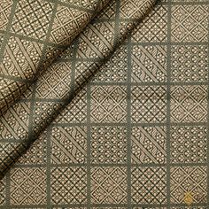 "\nAn unusual, artistic and slightly whimsical geometric play of zari. A\u00a0beautiful and chic\u00a0fabric with a gold\u00a0zari pattern on a bed of\u00a0katan silk.\u00a0\n\u00a0\n\n\nColor\u00a0-\u00a0A lovely shade of Bottle Green\u00a0\n\n\nTechnique\u00a0- The finest\u00a0Banarasi weaving techniques passed down through generations of weavers.\u00a0\n\nFabric\u00a0-\u00a0Soft as butter, pure\u00a0Katan\u00a0silk\n\n\nSpecifications\u00a0- A\u00a0magnificent\u00a0silken thaan with a\u00a0chowkadi pattern in opulent gold zari.\u00a0Handwoven luxury!\n\nTilfi Promise\u00a0- Pure. Handloom. Banaras.\nNote - 1 item equals 1 metre.\n\n\u00a0\nSince this product is handwoven, there might be slight irregularities. But don't you think these add to the singular charm of handloom beauties?"