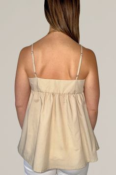 this cotton blend poplin babydoll tank top is an easy wear for the summer. throw on with your favorite pair of denim and sandals for an effortlessly put together look. 80% polyester | 20% cotton adjustable strap elastic high waist hand wash cold | hang dry | do not bleach dry clean if possible models are wearing a size small if in between sizes, we recommend sizing down made in the usa all sale items are final sale Chic Cotton Camisole With Built-in Bra, Summer Cotton Tops With Built-in Bra, Chic Cotton Tank Camisole, Everyday Cotton Camisole With Spaghetti Straps, Cotton Camisole With Straps, Beige Cotton Camisole With Tank Straps, Everyday Cotton Camisole, Chic Cotton Cami Tank Top, Cotton Camisole With Built-in Bra For Vacation