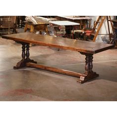 an old wooden table in a workshop