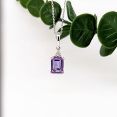 This classic pendant features a 1.99ct emerald cut Amethyst with natural earth mined diamonds set in solid 14k gold. This pendant makes a beautiful February birthstone gift for your loved ones! This pendant is made with solid 14k Gold and natural Earth mined SI / G-H diamonds. As listed, this pendant is ready to ship. If you're interested in purchasing this setting with a different center stone please message us! ***We also have 16" to 18" adjustable solid 14k Gold 0.93mm cable chains with a lob Emerald Cut Amethyst Birthstone Jewelry, Emerald Cut Diamond Gemstones For Gifts, Elegant Emerald-cut Birthstone Gemstones, Fine Jewelry White Gold Amethyst With Emerald Cut, Elegant Emerald Cut Birthstone Gemstones, Radiant Cut Diamond Birthstone Jewelry, Radiant Cut Diamond Jewelry With Birthstone, Emerald Cut Amethyst Jewelry With Accent Stones, Rectangular Amethyst Jewelry With Accent Stones