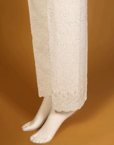 Description : Embroidered Cotton Trouser. Country of Origin : Pakistan Care Instruction : Should be washed in gentle cycle and hung to dry. Color may bleed so please be mindful of other items with it. Disclaimer : Size chart provides reference sizes and actual sizes might be slightly different from the size chart. Summer Cotton Pants With Chikankari Embroidery, Beige Cotton Pants With Floral Embroidery, White Cotton Bottoms With Embroidered Hem, White Cotton Bottoms With Floral Embroidery, Ecru Cotton Bottoms For Summer, Traditional Cotton Bottoms With Floral Embroidery, White Cotton Pants With Floral Embroidery, Spring Cotton Pants With Chikankari Embroidery, Spring Cotton Bottoms With Chikankari Embroidery