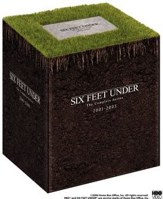 a box with grass growing out of it and the words sky feet under on top