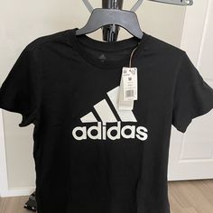 T-Shirt Women Adidas, Size M, Brand New With Tags. Black Color. Black Adidas T-shirt With Logo, Adidas Cotton T-shirt With Letter Print, Spring Adidas Logo Cotton T-shirt, Basic Adidas T-shirt With Graphic Print, Adidas Black T-shirt With Letter Print, Black Adidas Tops With Logo, Adidas Black T-shirt With Logo, Black Adidas Logo Short Sleeve Top, Black Adidas Logo Cotton T-shirt