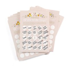 four pink stickers with white polka dots and flowers on them, each featuring the bride's name