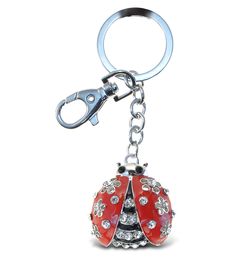 a ladybug keychain is shown on a white background