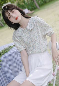 Floral printed button up shirt with a peter pan collar and short puff sleeves. S: 14.5" across shoulders, 38.5" chest, 23" lengthM: 15" across shoulders, 40" chest, 23" lengthL: 15.5" across shoulders, 41.5" chest, 23" length Casual Spring Blouse With Collar, Cute Spring Blouse With Peter Pan Collar, Casual Doll Collar Blouse For Spring, Casual Peter Pan Collar Blouse For Spring, Casual Short Sleeve Blouse With Lace Collar, Casual Blouse With Lace Collar And Short Sleeves, Cute Floral Print Short Sleeve Blouse, Cute Short Sleeve Floral Print Blouse, Cottagecore Summer Tops With Peter Pan Collar