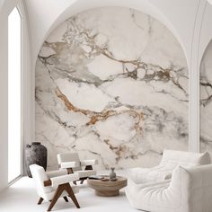 a living room with marble walls and white furniture