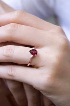 "\"Teardrop Cut Ruby Statement Ring with Diamonds | Red Ruby Gem Elegant Ring | 14k Gold Proposal Ring | Ruby Bride Wedding Ring \" Teardrop Cut Ruby 8k or 14K Solid Gold Ring with Diamonds, Perfect choice for engagement, wedding and statement. 2 diamonds used in the ring with real ruby. I can also make it with Sapphire Gemstone, please check below and contact me for details. https://www.etsy.com/listing/912308754 * Band Material: 8k/14k Solid Gold (Yellow, Rose and White options) * Gemstone: Di Lab-created Ruby Ring With Accent Stones As Gift, Solitaire Pear-shaped Jewelry For Proposal, Red Teardrop Ruby Ring For Gift, 14k Gold Pear-shaped Ruby Ring For Wedding, Teardrop Gemstone Ring For Proposal, Pear-shaped 14k Gold Gemstone Wedding Ring, Trillion Cut Diamond Ring With Accent Stones As Gift, Teardrop Diamond Ring For Gift, Teardrop Yellow Gold Ruby Ring For Wedding