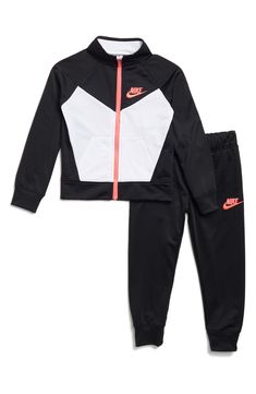 This sporty set pairs a woven tricot jacket with coordinating joggers that are complete with classic Nike branding. Includes jacket and joggers 100% polyester Machine wash, tumble dry Imported Nike Cotton Track Jacket For Sports, Sporty Sets For Fall Sports, Sporty Spring Sports Sets, Sporty Fall Sports Sets, Sporty Fleece Sets With Long Sleeves, Sporty Fleece Long Sleeve Sets, Black Tracksuit For Spring Sportswear, Black Spring Tracksuit Sportswear, Sporty Long Sleeve Fleece Sets