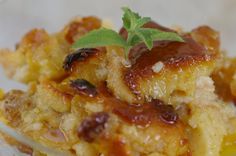 a close up of a plate of food with fruit and sauces on it,