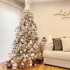 a white christmas tree in a living room