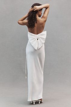 A dramatic back bow defines the Hutch Delphine Strapless Top, a playful statement piece for the rehearsal dinner or bachelorette party. | Delphine Strapless Bow-Back Top by Hutch in White, Women's, Size: 8, Polyester/Nylon at Anthropologie Chic White Bow For Party, Summer Party Bow With Bow Tie Back, Chic Evening Bow With Detachable Feature, Chic White Wedding Bow, Fitted Evening Bow With Bow Tie Back, Fitted Satin Bow For Evening, Chic Wedding Bow With Tie Back, Bow Back Top, Wedding Edit