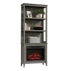 a bookcase with an electric fireplace in it