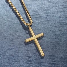 Wear your faith proudly with this men's cross necklace. This beautiful statement piece is crafted in sterling silver with 14k yellow gold plating and sits on a sturdy 24-inch gold plated stainless steel chain. The Paved Cubic Zirconia stone cross necklace for him showcases your faith and belief. It adds protection and a unique look to your wardrobe. Discover all our sleek 925 silver jewelry for men and find a gift for him HERE Made with yellow gold plated 925 sterling silver. Color: Yellow Plain Gold Spiritual Cross Necklace In Stainless Steel, Gold Stainless Steel Spiritual Cross Necklace, Gold Stainless Steel Crucifix Jewelry, Gold Stainless Steel Cross Jewelry, Gold Cross Necklace For Father's Day, Spiritual Cross Jewelry For Father's Day, Silver Jewelry For Men, Necklace For Him, Stone Cross