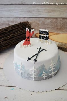 a white cake decorated with an image of a fox