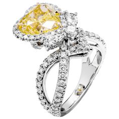 Unique and Rare! Designed and custom made by M&V Vanguard Jewelry in 2020, Ring features Diamond Double twisted shank, Fancy gallery Under the center stone , specifically designed to highlight a beauty of Fancy Light Yellow Diamond. Under gallery features 2 pear shape and 1 round diamond , totaling 0.48ct F-G color, VS1 clarity. Mounted in Platinum 950 & 18K Yellow Gold Exceptional pave work, delicate, yet sturdy, featuring 1.25ct of full cut round brilliants. Center stone details: Measurements Luxury Rings With Intricate Design And Unique Style, Light Yellow Diamond, Goth Wardrobe, Fancy Light, Fancy Lights, Yellow Rings, Diamond Jewelry Necklace, Big Rings, Alternative Engagement Rings