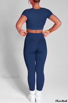 Olivia Mark - Premium Black Casual Two-Piece Sportswear Set: Stylish Solid Patchwork Design and Comfortable O-Neck Short Sleeves Stretch V-neck Activewear For Pilates, Seamless Compression Unitard For Gym, Stretch Seamless Unitard For Sports, Seamless Stretch Unitard For Sports, Seamless Slim Fit Athleisure Activewear, Athleisure Compression Unitard With Seamless Design, Compression Athleisure Unitard With Seamless Design, Compression Seamless Unitard In Athleisure Style, Stretch Moisture-wicking Solid Unitard