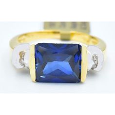 Metal Purity: 10k Yellow Gold Condition: New With Tag Gemstone Type: 1 Genuine Blue Sapphire 3.86 Carats Blue Sapphire Grades, Hue . . .Blue Tone . . . Medium Dark Saturation . . . Vivid Cut . . . Very Good No Inclusions 4 Genuine Diamonds - 0.015 Carats Each Diamond Grades, Clarity Grade . . I1 Color Grade . . . Ij Ring Size: 7 (Resizing Service Available If Needed) Dimensions: 10 Mm X 8 Mm - Gemstone Measurements Certificate Appraisal Available If Interested Classic Blue Gemstones For Anniversary, Blue Baguette Cut Rings With Diamond Accents, Blue Sapphire Ring With Vvs Clarity In 14k Gold, Blue Tanzanite Rings With Diamond Accents, Blue Sapphire Ring With Diamond Accents, Baguette Cut, Blue Baguette Cut Cubic Zirconia Rings, Blue Cubic Zirconia Baguette Cut Rings, Blue Diamond Ring With Baguette Cut And Accent Stones, Classic Blue Topaz Ring With Vvs Clarity