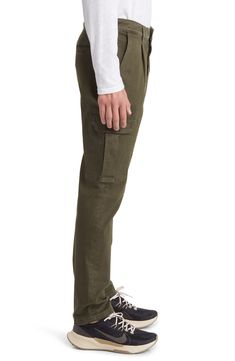 Rock a contemporary look in these stretch-twill pants made with a pleated waist, tapered legs and a mix of utility pockets. 32" inseam 97% cotton, 3% Lycra® spandex Machine wash, dry flat Imported Utility Style Relaxed Fit Chinos With Belt Loops, Elevated Casual Tapered Leg Cargo Pants, Fall Cargo Pants For Elevated Casual With Belt Loops, Utility Tapered Pants With Side Pockets, Fitted Utility Pants With Patch Pockets, Tapered Utility Pants With Side Pockets, Tapered Utility Cargo Pants With Patch Pockets, Cotton Cargo Pants With Tapered Legs And Belt Loops, Fitted Khaki Cargo Pants With Welt Pockets