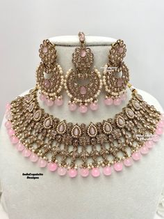 Gorgeous Antique gold Polki Necklace Set comes with beautiful earrings and tikka / Indian Jewelry/ High Quality Kundan and Polki Jewelry/ Bollywood Jewelry/Wedding Jewelry/baby pink  All items are shipped from Brampton, Ontario, Canada. If you need your item by a certain day, please reach out to us for express delivery option before placing the order so that we can update the shipping for you. Standard shipping/delivery timeline Below are the estimated delivery times after the order is shipped/d Pink Kundan Necklace For Festivals, Heavy Pink Bridal Necklace For Wedding, Pink Kundan Jewelry Sets, Pink Round Kundan Necklace For Diwali, Pink Chandbali Kundan Necklace For Wedding, Heavy Pink Kundan Necklace For Wedding, Festive Pink Chandbali Bridal Necklace, Pink Jewelry With Intricate Design For Party, Bollywood Style Pink Kundan Tikka