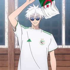 a man with white hair wearing sunglasses and a t - shirt holding a flag in front of him