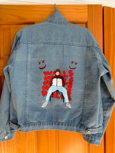 A hand painted denim Jacket inspired by the cover of Louis Tomlinson's debut album Walls. The sizing on the jacket is custom, jacket in the picture is a Size L. Louis Tomlinson Denim Jacket, Custom Artwork Long Sleeve Cotton Denim Jacket, Casual Blue Denim Jacket With Custom Artwork, Casual Denim Jacket With Custom Artwork For Fall, Casual Cotton Denim Jacket With Custom Artwork, Trendy Cotton Denim Jacket With Custom Artwork, Long Sleeve Cotton Denim Jacket With Custom Artwork, Spring Denim Jacket With Custom Artwork For Streetwear, Hand Painted Cotton Denim Jacket For Winter