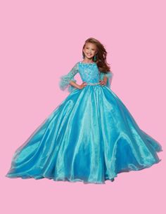 The Sugar Kayne C338 Preteen Pageant Dress is an elegant A-line ballgown featuring sequin and feather sleeves. Featuring the highest quality materials, this dress is perfect for special occasions and is sure to make your child feel like a princess. Experience twinkling elegance in this Metallic Organza Ballgown. The feathered sleeves are designed to make you feel like royalty. Color: Aqua, Petal Pink, WhiteSize: 2, 4, 6, 8, 10, 12, 14, 16Fabric: Organza, Metallic Organza, Mesh, Satin Lining(Size Tulle Ball Gown For Fancy Dress Pageant, Elegant Feather Trim Dress For Pageant, Elegant Ball Gown For Prom Season Fancy Dress, Ball Gown With Lace Sleeves And Fitted Bodice, Princess Style Long Sleeve Ball Gown For Pageant, Princess Evening Ball Gown Pageant Dress, Princess Style Ball Gown Pageant Dress For Evening, Princess Style Evening Ball Gown Pageant Dress, Pageant Dresses With Lace Sleeves