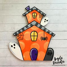 a paper house decorated with halloween decorations