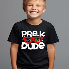 Get your little one ready for their first day of Pre-K in style with our Pre-K Dude shirt! This back to school tee is perfect for both boys and girls and features a fun and vibrant design that will make your child stand out on their special day. Our Pre-K Dude shirt is designed with the needs of busy parents in mind. It's easy to care for and can be machine washed and dried, making laundry day a breeze. This Kids Boy Girl back to school Tee is not only stylish, but it also serves as a great conv Playful T-shirt For Back To School, Casual Tops For Birthday And Back To School, Casual Tops For Back To School Playtime, School Spirit T-shirt For Birthday And Back To School, Casual Tops For Back To School, Casual T-shirt For Back To School Playtime, Playful Back To School T-shirt, Playful Back-to-school T-shirt For Playtime, End Of School Year Graphic Print T-shirt For Playtime