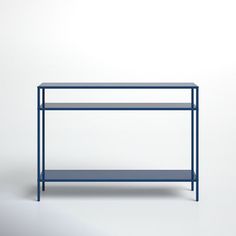 a blue shelf sitting on top of a white wall next to a black table with two shelves underneath it